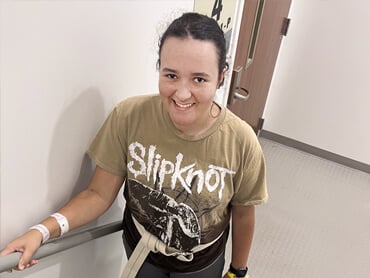 Alex Evans climbs the stairs during therapy.